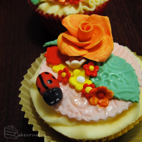 Flower lady bug cupcake design inspiration